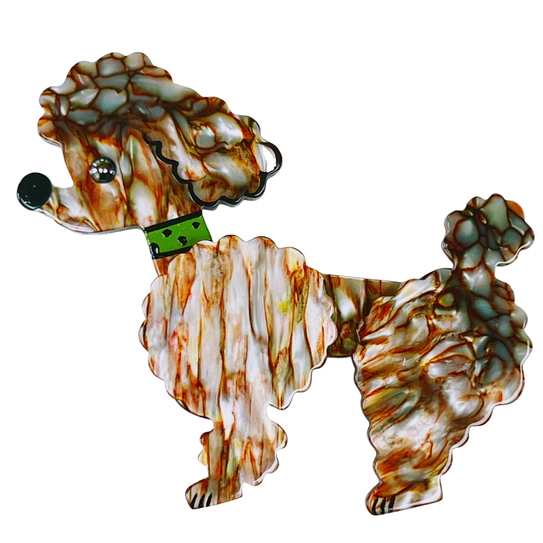 Iridescent Red and Beige Ari Poodle Dog Brooch with a green necklace