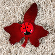 Small Ginger vine Leaf Brooch with a red ladybug